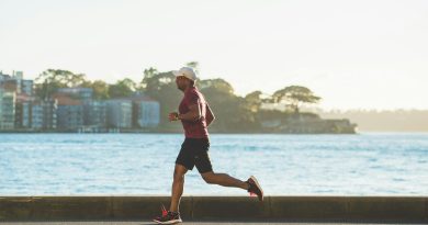 man running near sea during daytime
